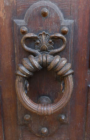 European Vintage old metal wrought iron door knocker. Design detail. Paris.の写真素材