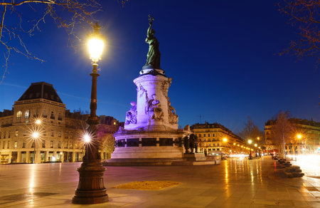Monument to the republic at night . It is bronze statue of Marianne, a personification of the French republic at the Place de Republique in Paris.の写真素材