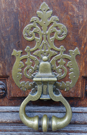 European Vintage old metal wrought iron door knocker. Design detail. Paris.の写真素材