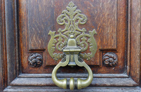 European Vintage old metal wrought iron door knocker. Design detail. Paris.の写真素材