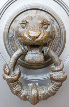 European Vintage old metal wrought iron door knocker. Design detail. Paris.の写真素材