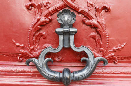European Vintage old metal wrought iron door knocker. Design detail. Paris.の写真素材