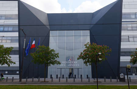 Main entrance of Hexagone Balard, new seat of the French Ministry of Defence, flying three French flagsのeditorial素材
