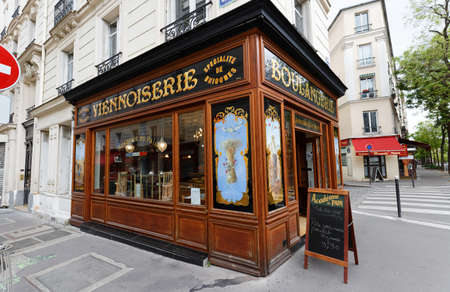 The vintage bakery and cake shop Academie du pain located in 14th district of Paris. The front shows the ornaments of woodwork , set under glass, with gold leaf.のeditorial素材