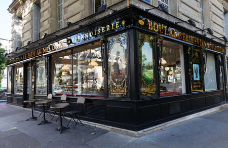 The vintage bakery and cake shop Le Pain au naturel located in 15h district of Paris. The front shows the ornaments of woodwork , set under glass, with gold leaf.のeditorial素材