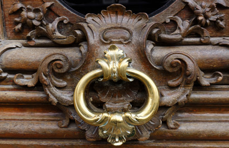 European Vintage old metal wrought iron door knocker. Design detail. Paris.の写真素材
