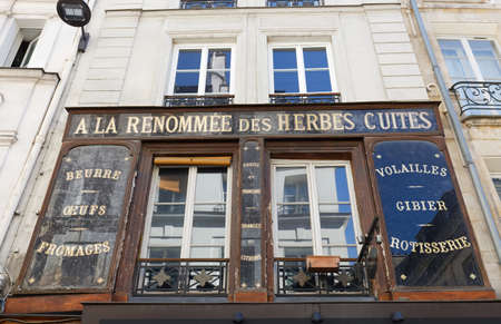The vintage facade of ancient boutique located at Saint Honore street in Paris, France.のeditorial素材