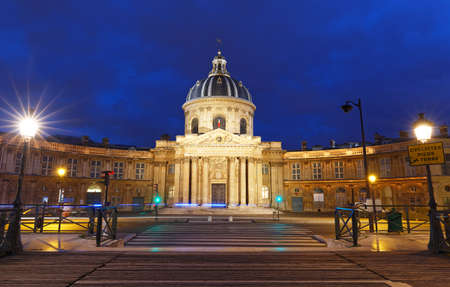 The view of French Academy and Arts bridge at night , Paris, France.の写真素材