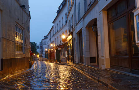 The Montmartre street at rainy evening , Paris, Franceの写真素材