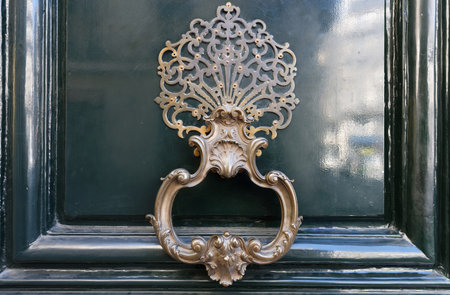 European Vintage old metal wrought iron door knocker. Design detail. Paris.の写真素材