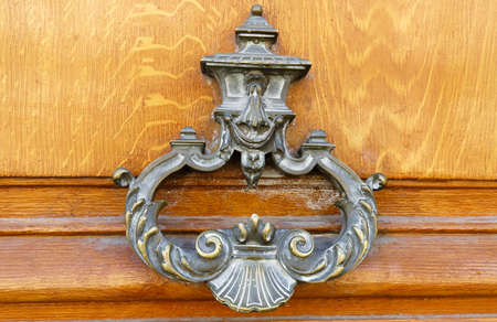 European Vintage old metal wrought iron door knocker. Design detail. Paris.の写真素材