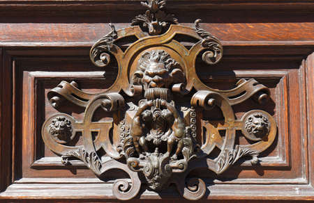 European Vintage old metal wrought iron door knocker. Design detail. Paris.の写真素材
