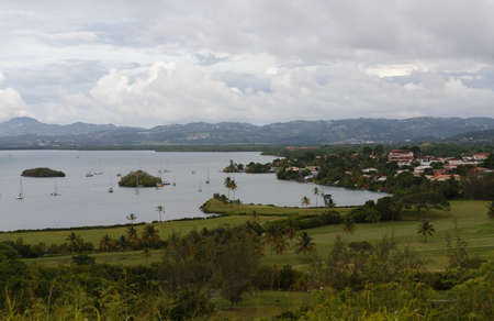 The landscape view over the beautiful Tois Ilets bay, its gorgeous nature, hills, forest, Caribbean sea , French West Indies.の写真素材