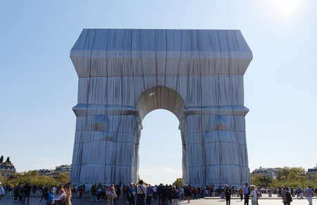The Triimphal Arch in Paris swathed in silvery blue fabric and red rope as a posthumous project planned by the artist Christo. Paris, France.のeditorial素材