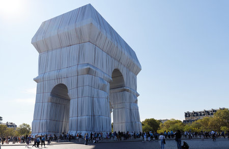The Triimphal Arch in Paris swathed in silvery blue fabric and red rope as a posthumous project planned by the artist Christo. Paris, France.のeditorial素材