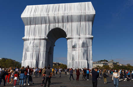 The Triimphal Arch in Paris swathed in silvery blue fabric and red rope as a posthumous project planned by the artist Christo. Paris, France.のeditorial素材