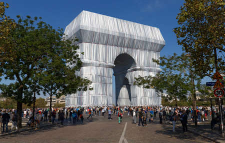 The Triimphal Arch in Paris swathed in silvery blue fabric and red rope as a posthumous project planned by the artist Christo. Paris, France.のeditorial素材