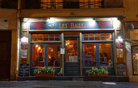 The French traditional restaurant Les Baux de Paris located in Latin quarter at night, Paris, France.のeditorial素材