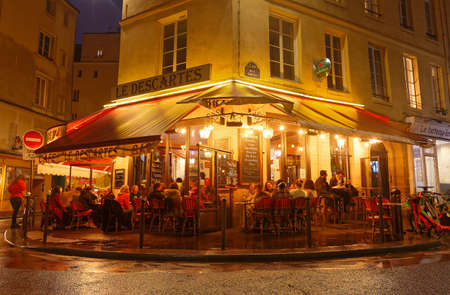 The French traditional restaurant Le Descartes located in Latin quarter at night, Paris, France.のeditorial素材