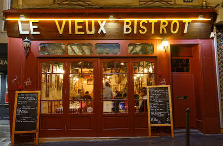 The French traditional restaurant Le Vieux Bistrot located in Latin quarter at night, Paris, France.のeditorial素材