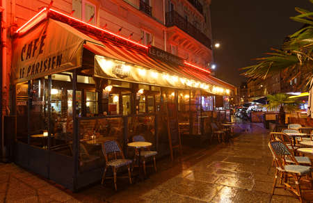 The French traditional restaurant Le Cafe Parisien located in Latin quarter at night, Paris, France.のeditorial素材