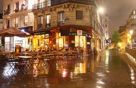 The French traditional restaurant Cave La Bourgogne located in Latin quarter at night, Paris, France.のeditorial素材