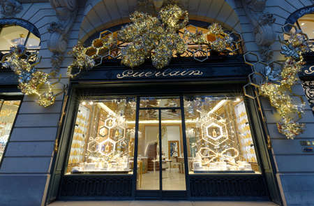 Guerlain store at Avenue des Champs-Elysees decorated for Christmas in Paris . Guerlain is one of the most premier luxury labels of fragrances in the world.のeditorial素材