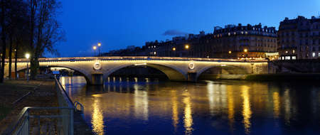 The night panoramic view of Louis-Philippe bridge, Paris, France.の写真素材