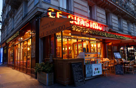 The famous cafe Le Quasimodo decorated for Christmas located near Notre Dame cathedral in Paris, France.のeditorial素材