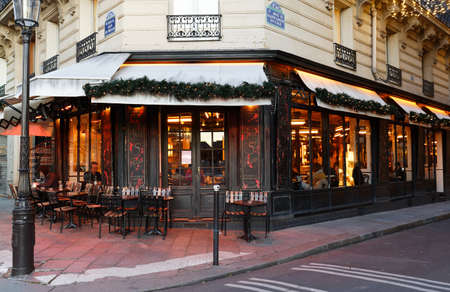 The famous cafe S. Regis decorated for Christmas located near Notre Dame cathedral in Paris, France.のeditorial素材