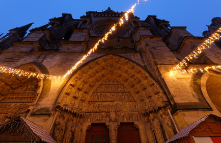 Cathedral of Notre Dame, Reims and Christmas market stalls in the night. One of the most stunning masterpieces of 13th century Gothic art.の写真素材