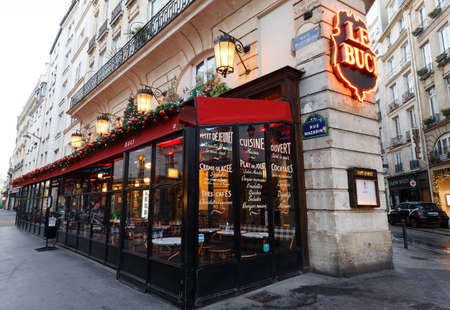 The traditional French cafe Le Buci decorated for Christmas 2021 . It located near Saint Germain boulevard in Paris, France.のeditorial素材