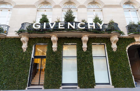 Givenchy company headquarters and store decorated for Christmas at Montaigne avenue in Paris, France. Givenchy is a luxury brand owned by French conglomerate LVMH.のeditorial素材