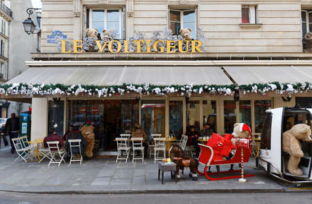 The traditional French cafe Voltigeur decorated for Christmas 2021 . It located in Marais district of Paris, France.のeditorial素材