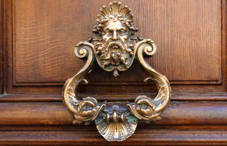 European Vintage old metal wrought iron door knocker. Design detail. Paris.の写真素材