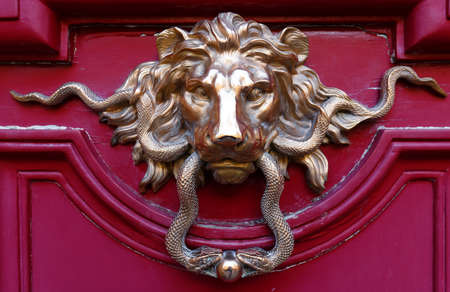 European Vintage old metal wrought iron door knocker. Design detail. Paris.の写真素材