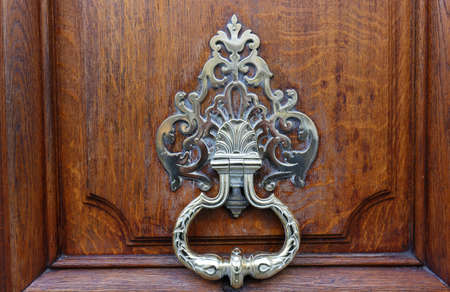 European Vintage old metal wrought iron door knocker. Design detail. Paris.の写真素材