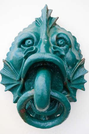 European Vintage old metal wrought iron door knocker. Design detail. Biarritz.の写真素材