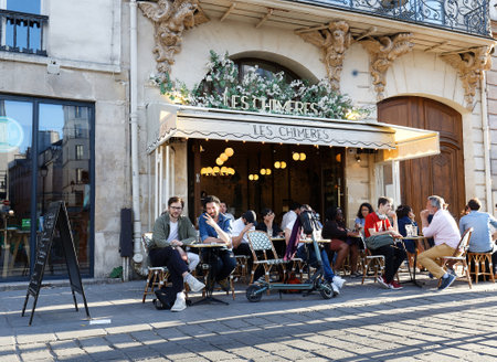 The cafe Les Chimeres situated in a busy corner of the place de Saint Paul in Paris , France.のeditorial素材