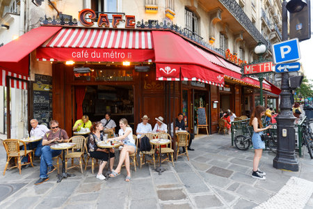 View of typical Parisian cafe du Metro . It is located near famous Saint Germain boulevard in Paris, France.のeditorial素材