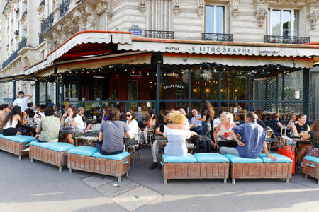Le Lithographe is traditional French bistro located at boulevard Raspail, at the exit of the Raspail metro station, right next to the Montparnasse cemetery. Paris. France.のeditorial素材