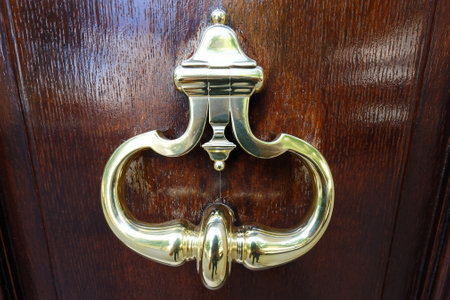 European Vintage old metal wrought iron door knocker. Design detail. Paris.の写真素材
