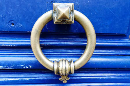European Vintage old metal wrought iron door knocker. Design detail. Paris.の写真素材