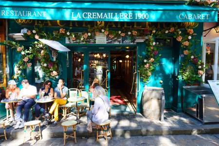 The traditional French restaurant La Cremaillere 1900 decorated at sunny day . It located in Montmartre in 18th district of Paris, France.のeditorial素材