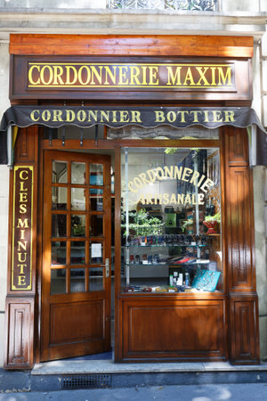 A vintage Artisanal Cobbler shop Maxim located in 18th district of Paris in Montmartre area. Paris. France.のeditorial素材