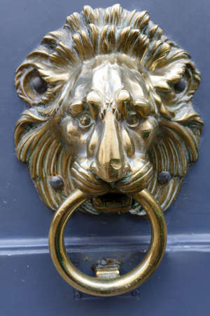 European Vintage old metal wrought iron door knocker. Design detail. Paris.の写真素材