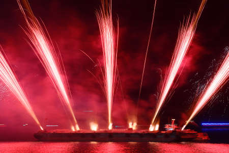 Gorgeous multi-colored fireworks display on dark blue night sky .の写真素材