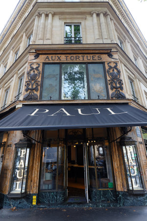 The facade of the PAUL bakery shop located at the corner of Boulevard Haussman and Rue Tranchet. Paris. France.のeditorial素材