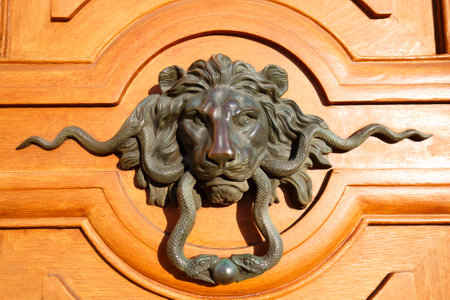 European Vintage old metal wrought iron door knocker. Design detail. Paris.の写真素材