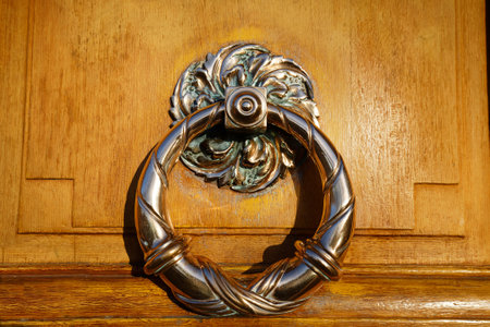 European Vintage old metal wrought iron door knocker. Design detail. Paris.の写真素材